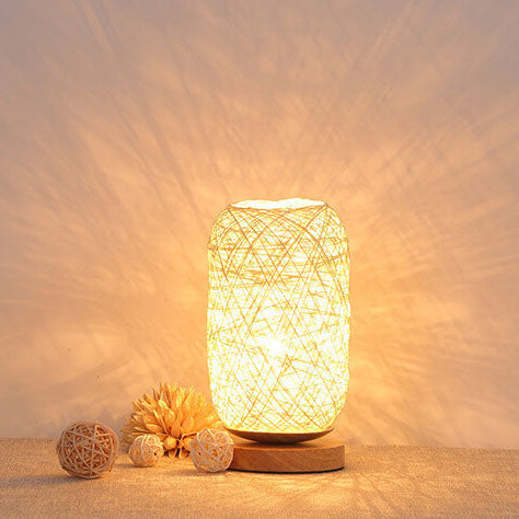 Japandi-style table lamp made of woven rattan and wood